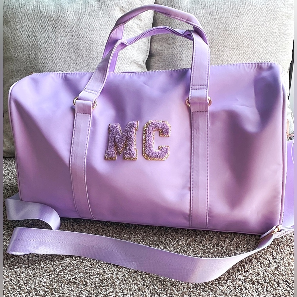 MC New Without Tags duffel bag ,Never been Used .Lilac Color